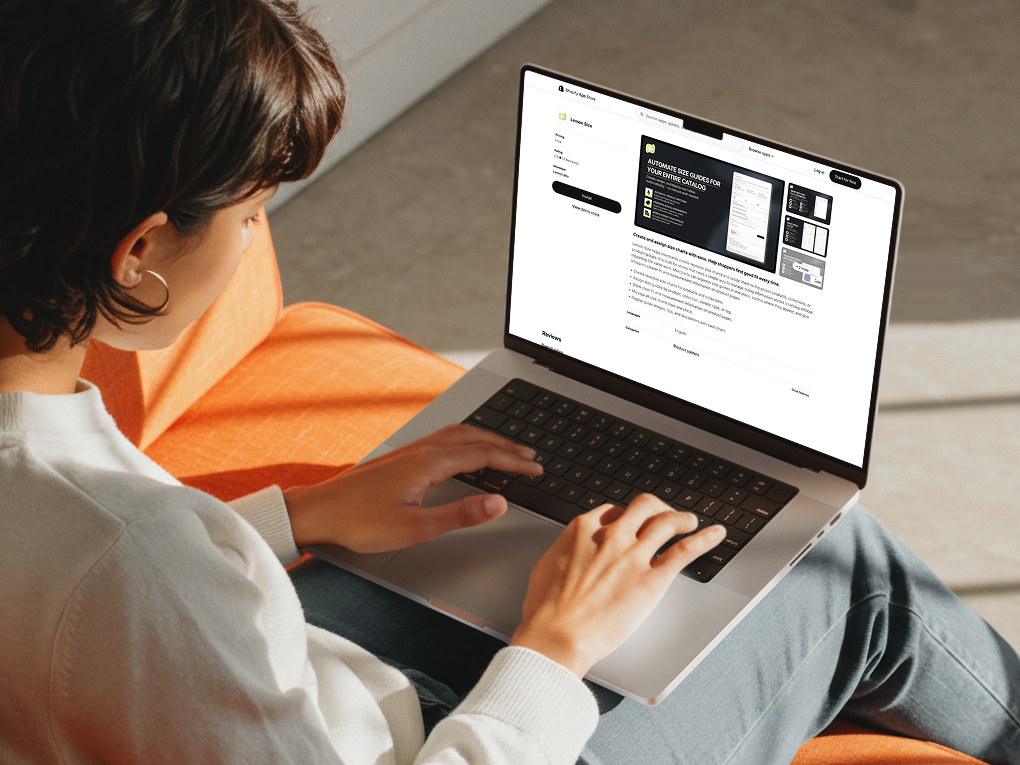 MacBook Pro mockup of a woman working on laptop - lemon size app on screen